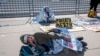 Activists demonstrate at the Supreme Court as the justices consider a challenge to rulings that found punishing people for sleeping outside when shelter space is lacking amounts to unconstitutional cruel and unusual punishment, in Washington, Monday, April 22, 2024. 