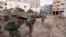 FILE - Israeli soldiers take part in a ground operation in Gaza City's Shijaiyah neighborhood, Dec. 8, 2023. U.S. Secretary of State Antony Blinken has approved an emergency weapons sale to Israel as Israel continues its war against Hamas in Gaza. 