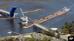 FILE - The Popp's Ferry Bridge in Biloxi, Mississippi, is seen on March 20, 2009 after it was hit and damaged by a barge trying to navigate through the drawbridge. 