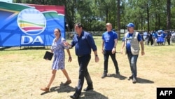 FILE - Leader of the South African opposition party Democratic Alliance (DA) John Steenhuisen (2nd L) arrives to address supporters during the DA's manifesto launch at the Union Buildings in Pretoria, Feb. 17, 2024.