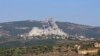 Israel hits Hezbollah targets after rocket strike from Lebanon kills 12