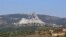 Smoke billows following an Israeli airstrike in the southern Lebanese border village of Chihine, July 28, 2024. Deadly cross-border exchanges have escalated between Israeli troops and mainly Hezbollah fighters on the Israel-Lebanon frontier.