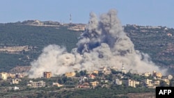 Smoke billows following an Israeli airstrike in the southern Lebanese border village of Chihine, July 28, 2024. 