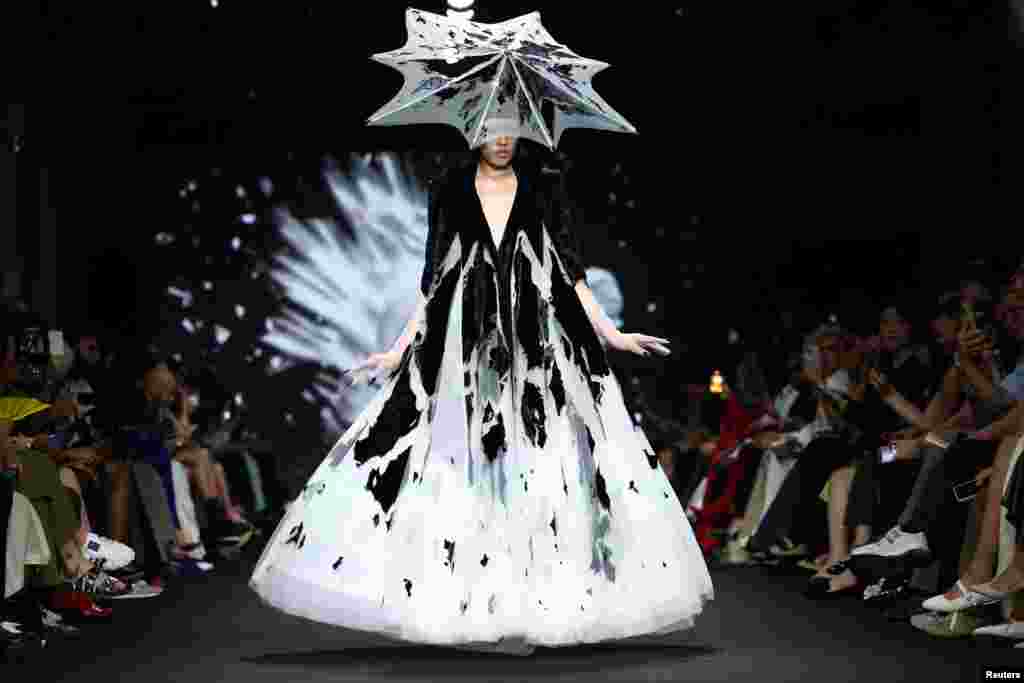 A model presents a creation by designer Robert Wun as part of his Haute Couture Fall/Winter 2024-2025 collection show in Paris, France.