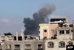 Smoke rises following Israeli bombardment in Jabalia in the northern Gaza Strip on May 12, 2024, amid the ongoing conflict between Israel and the Palestinian Hamas movement.