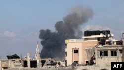 Smoke rises following Israeli bombardment in Jabalia in the northern Gaza Strip on May 12, 2024, amid the ongoing conflict between Israel and the Palestinian Hamas movement.