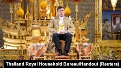 Thai King Maha Vajiralongkorn sits during a ceremony to celebrate his 71st birthday at the Grand Palace in Bangkok, Thailand, July 28, 2023. 