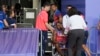 Noah Lyles of the United States is helped off the track after the men's 200-meter final at the 2024 Summer Olympics, Aug. 8, 2024, in Saint-Denis, France. 