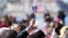 FILE - People recite an oath during a naturalization ceremony, Feb. 15, 2023, in San Diego, California.