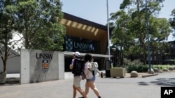 FILE - Students walk around the University of New South Wales campus in Sydney, Australia, Dec. 1, 2020. 