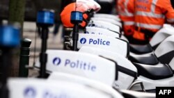FILE - This photograph shows a Belgian police logo on police bikes during a protest near the headquarters of the Federal Police in Brussels, on Jan. 11, 2023. On March 29, seven people were charged over "possible terrorist attacks" in the country.