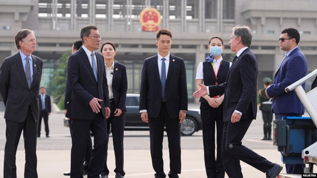 U.S. Secretary of State Antony Blinken is welcomed by Yang Tao, Director General of the Department of North American and Oceanian Affairs of the Foreign Ministry, at the Beijing Capital International Airport in Beijing, April 25, 2024.