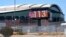 FILE - With Chase Field, home of the Arizona Diamondbacks baseball team in the background, a digital billboard updates the time and temperature as temperatures are expected to hit 116° F in Phoenix, Arizona, July 18, 2023.