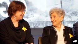 FILE - Polish researcher Barbara Engelking, left, attends a news conference alongside Holocaust survivor Krystyna Budnicka about an exhibition at the POLIN Museum of the History of Polish Jews, in Warsaw, Poland, April 13, 2023.