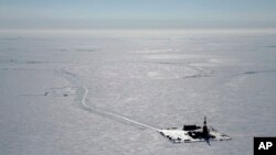 FILE - This 2019 aerial photo provided by ConocoPhillips shows an exploratory drilling camp at the proposed site of the Willow Project on Alaska's North Slope. 
