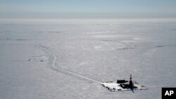 FILE - This 2019 aerial photo provided by ConocoPhillips shows an exploratory drilling camp at the proposed site of the Willow oil project on Alaska's North Slope. 