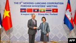 Thailand's Foreign Affairs Permanent Secretary Eksiri Pintaruchi, right, greets China's Foreign Minister Wang Yi during the Mekong-Lancang Cooperation Foreign Ministers' Meeting in Chiang Mai, Aug. 16, 2024. (Thailand's Ministry of Foreign Affairs via AFP)