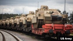 FILE - M1A1 Abrams tanks arrive at Grafenwoehr, Germany, May 12, 2023. The tanks will be used for training of Ukrainian Armed Forces personnel.