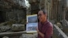 Long Kosal, spokesperson for APSARA, the Cambodian office that oversees the Angkor archaeological site, speaks to the Associated Press inside the Ta Prohm temple at Angkor Wat temple complex in Siem Reap province, Cambodia, Apr. 3, 2024. 