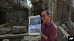 Long Kosal, spokesperson for APSARA, the Cambodian office that oversees the Angkor archaeological site, speaks to the Associated Press inside the Ta Prohm temple at Angkor Wat temple complex in Siem Reap province, Cambodia, Apr. 3, 2024. 