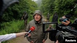 Kosovo's Interior Minister Xhelal Svecla talks to the media near the village of Bare, June 14, 2023. 
