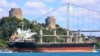FILE - The cargo ship Mikhail Nenashev sails past Istanbul, Turkey, July 4, 2022. An Associated Press investigation shows the ship, owned by a sanctioned Russian state-owned defense contractor, has been hauling stolen Ukrainian grain from Crimea to customers in the Middle East.