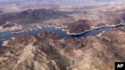 FILE - In this aerial photo, a bathtub ring of light minerals show the high water mark on the shore of Lake Mead along the border of Nevada and Arizona, Monday, March 6, 2023, near Boulder City, Nevada.