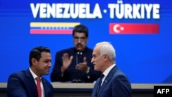 FILE - When economic officials of Venezuela and Turkey met in Caracas on Jan. 24, 2023, the hosts used their guests' preferred spelling of their nation's name in signage.