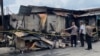 Polisi sedang menyelidiki rumah jurnalis yang terbakar di Kabanjahe, Kabupaten Karo, Sumatera Utara, 27 Juni 2024. (Foto: Polres Tanah Karo)