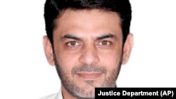 This image provided by the Justice Department, contained in the complaint supporting the arrest warrant, shows Asif Merchant. A Pakistani man alleged to have ties to Iran has been charged in a plot to carry out political assassinations on U.S. soil, the Justice Department said. 