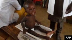 FILE - Health officials measure a malnourished baby at a health clinic in Nigeria, on Sept. 21, 2021. Doctors Without Borders warns that severe malnutrition has increased dramatically in Bauchi state between January and June 2024.