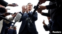 U.S. Secretary of State Antony Blinken speaks to members of the media before boarding his plane to return to Washington, following his week-long trip aimed at calming tensions across the Middle East, in Cairo, Egypt, Jan. 11, 2024. 