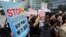 Protesters stand outside the Japanese Embassy in Seoul, South Korea, to denounce the release of treated radioactive water into the sea from the damaged Fukushima nuclear power plant, Aug. 24, 2023.