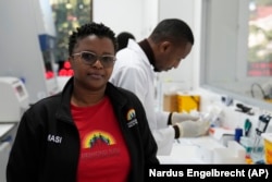 Thandeka Nkosi, coordinator of the clinical tests, is in the laboratory at the Desmond Tutu Health Foundation's Masiphumelele Research Site, in Cape Town, South Africa, July 23, 2024. (AP Photo/Nardus Engelbrecht)