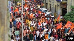 Devotees take part in a religious procession to celebrate the annual Hindu festival of Ram Navami in Ahmedabad on March 30, 2023.