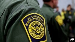 FILE - Border Patrol agents at a new US Customs and Border Protection temporary facility near the Donna International Bridge in Donna, Texas, May 2, 2019.