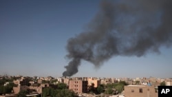 FILE - Smoke is seen in Khartoum, Sudan, April 19, 2023. The U.S. conducted its first organized evacuation of citizens and permanent residents from Sudan on April 29, said the U.S. State Department.