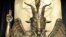 FILE - The Baphomet statue is seen in the conversion room at the Satanic Temple in Salem, Massachusetts, on Oct. 8, 2019.