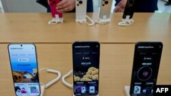 Huawei's latest Pura 70 series phone is displayed at a store in Shanghai, China, April 18, 2024. The United States has revoked certain licenses for exports to Chinese tech giant Huawei, the Commerce Department said, drawing opposition from Beijing, May 8, 2024.