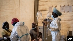 FILE - Health workers treat cholera patients at the Bwaila Hospital in Lilongwe, Malawi, Jan. 11, 2023.