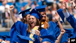 FILE - Graduates celebrate during the University of Delaware Class of 2022 commencement ceremony in Newark, Del., May 28, 2022. 