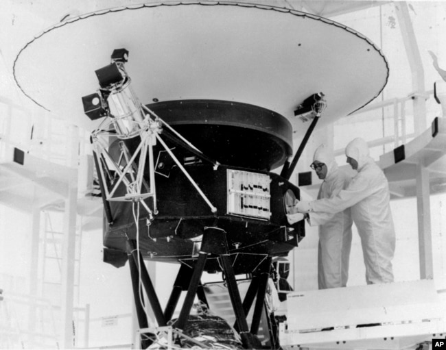 In this Aug. 4, 1977, photo provided by NASA, the 'Sounds of Earth' record is mounted on the Voyager 2 spacecraft in the Safe-1 Building at the Kennedy Space Center, Fla. (AP Photo/NASA, File)