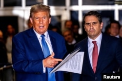 Former U.S. President Donald Trump speaks alongside his attorney Todd Blanche at the end of the day outside the courtroom during his hush money trial at Manhattan Criminal Court in New York, May 20, 2024.