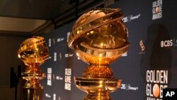 FILE - Replicas of Golden Globe statues appear at the nominations for the 81st Golden Globe Awards at the Beverly Hilton Hotel on Dec. 11, 2023, in Beverly Hills, Calif. 