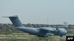 FILE - A German Air Force plane is seen on the tarmac of the Diori Hamani airport in Niamey, Niger, Sept. 22, 2023. The German army will end operations at its air base in Niger by Aug. 31, 2024.
