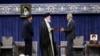Iran's Supreme Leader Ayatollah Ali Khamenei gives a Presidential decree to Iran's new president, Masoud Pezeshkian, during an endorsement ceremony in Tehran, July 28, 2024. (Office of the Iranian Supreme Leader/WANA/Handout via Reuters) 