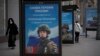FILE - A billboard shows a picture of a Russian soldier awarded with a medal for his actions in Ukraine, in Moscow, Russia, Nov. 15, 2022.