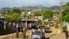 FILE - Army officers stand guard as police officers patrol in Lashio, northern Shan State, Myanmar, May 29, 2013. Ethnic armed groups claimed on July 25, 2024 to have captured the strategically important towns of Lashio and Mogok. 