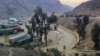 FILE - Trucks sit at the Torkham border crossing point on Afghanistan's border with Pakistan, Feb. 21, 2023. Pakistani authorities closed the crossing on Sept. 6, 2023, after border guards from the two sides exchanged fire, officials and residents said.
