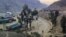 FILE - Trucks loaded with goods are seen parked at border crossing point Torkham in Afghanistan's eastern Nangarhar province, on the country's border with Pakistan, Feb. 21, 2023. Pakistani authorities closed the crossing on Sept. 6, 2023.